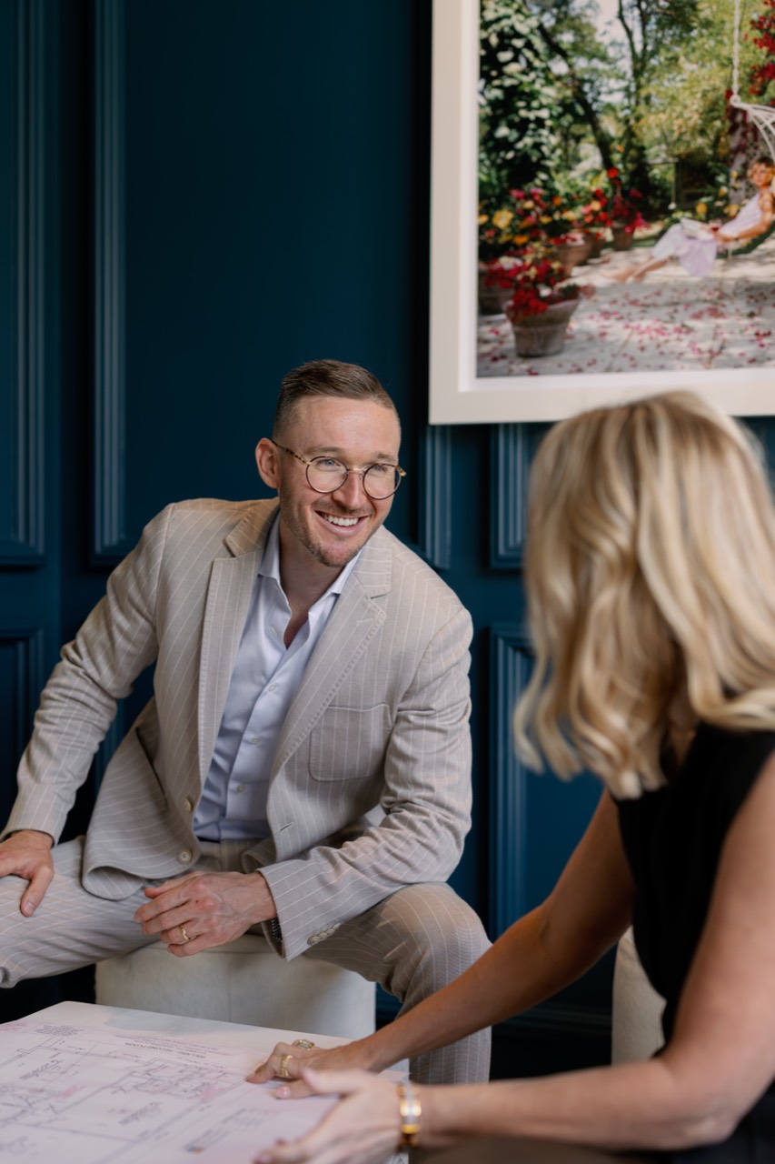 Adam reviewing project plans in the KBF showroom